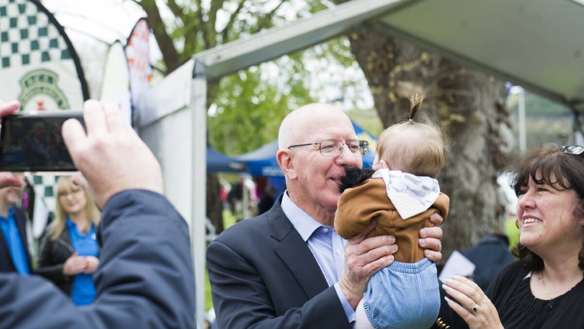 Governor-General David Hurley meets a baby at the 2019 Government House open day 2019. Picture: Dion Georgopoulos