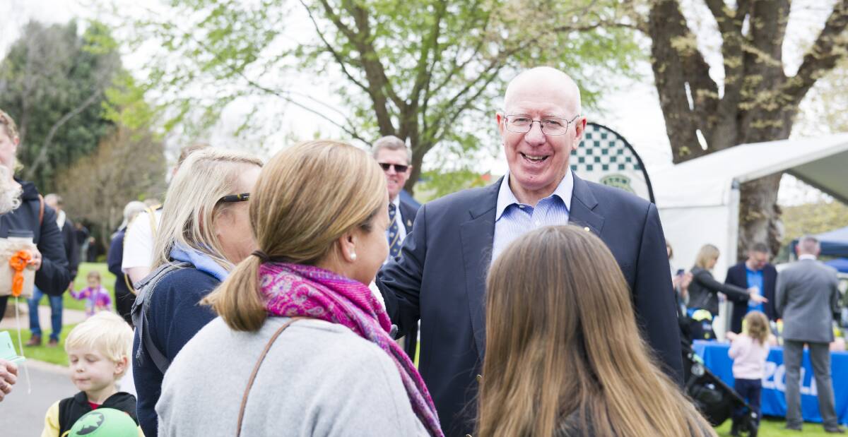 Governor-General David Hurley speaks with families at Government House open day on Sunday, when thousands saw inside the house. Picture: Dion Georgopoulos
