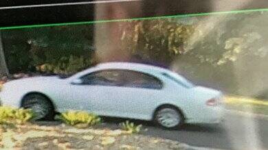 Security footage of a white Ford Falcon, that was seen in the area at the time of the break-in. Picture: ACT Policing