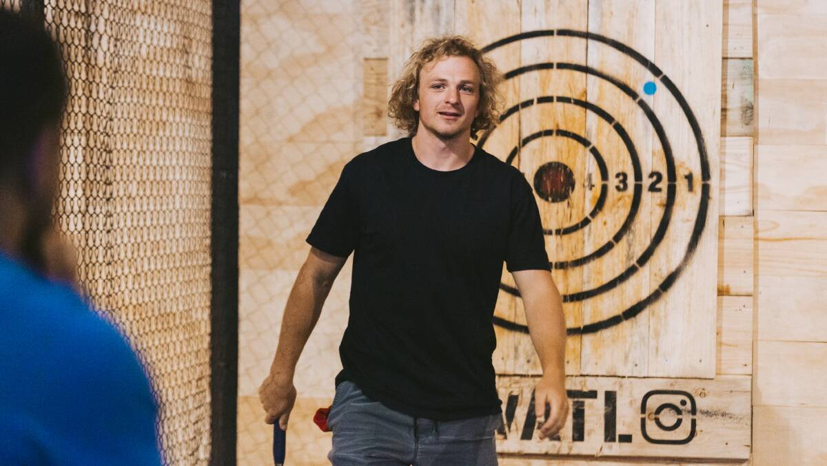 Joe Powell did some axe throwing as part of a team bonding session with the Canberra Vikings last week. Picture: Jamila Toderas
