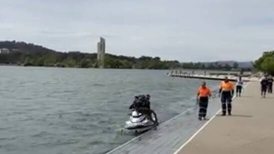 Stillshot from the video showing police rescuing a kangaroo from Lake Burley Griffin. Picture: Reddit-U/Misterturkey
