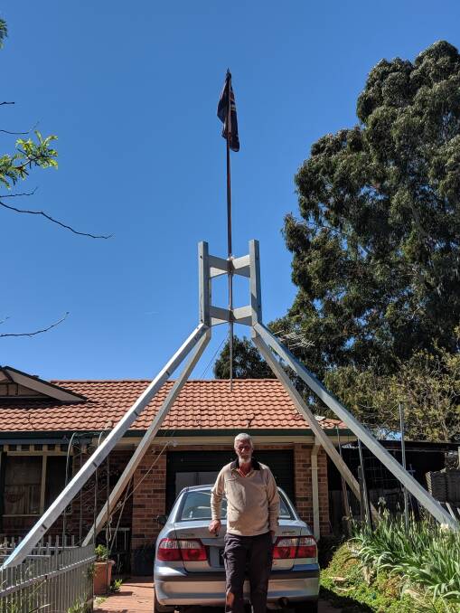 Allen Greenwood with this Parliament House flagpole in Dunlop. Picture: Megan Doherty