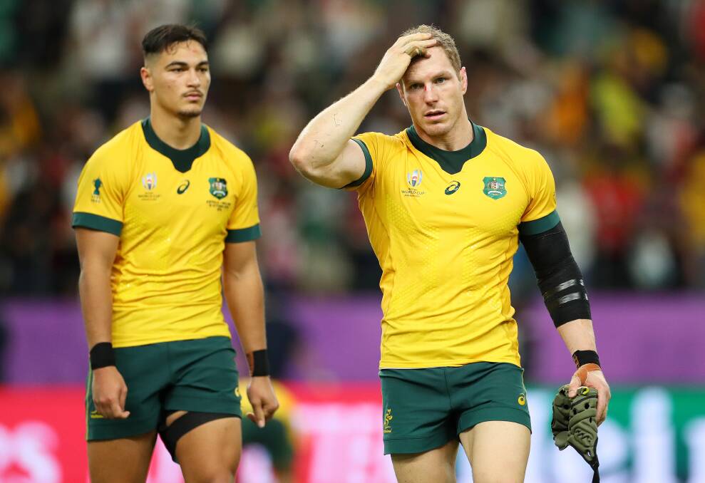David Pocock, right, and Jordan Petaia show their dejection after the Wallabies' exit. Picture: Getty Images