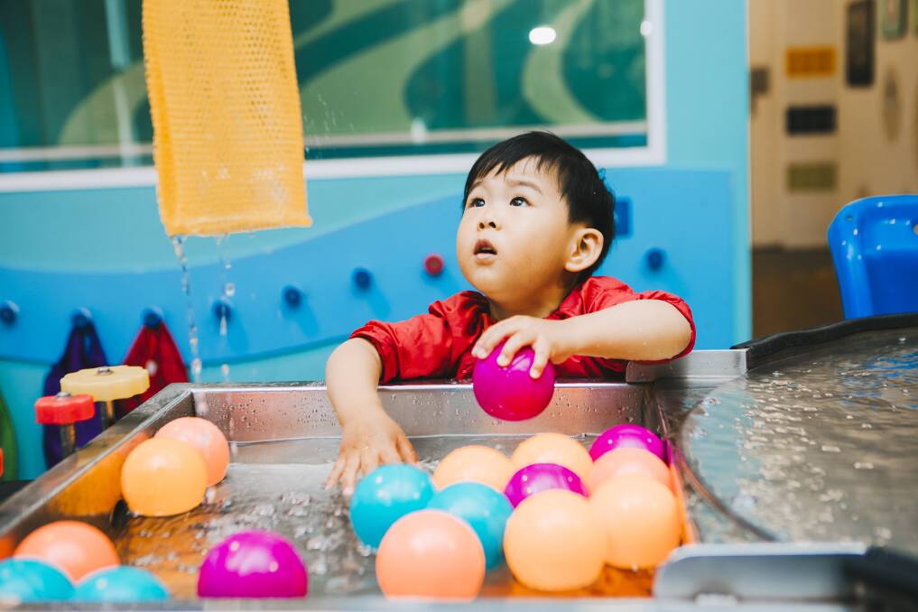 Ryan Zhang, 2, is playing in Questacon's Mini Q section, "a custom-built environment for little scientists". Picture: Jamila Toderas