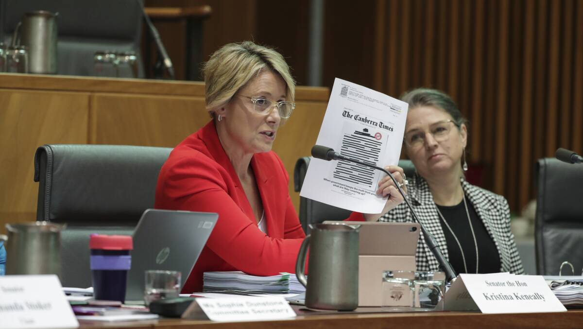 Labor's Deputy Senate Leader Senator Kristina Keneally holds up a copy of front page of The Canberra Times during questions on press freedom. Picture: Alex Ellinghausen