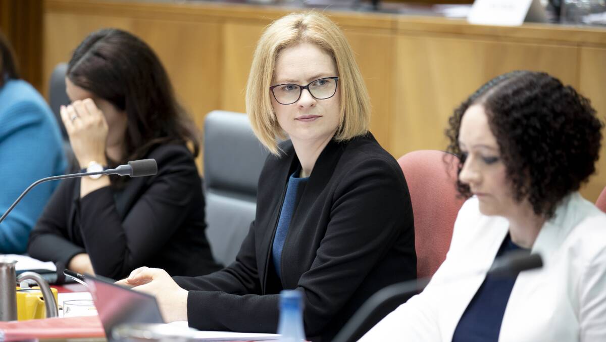 Senator Amanda Stoker, right, at estimates hearings on Tuesday: Universities not giving people accused of sexual harassment a fair hearing. Picture: Sitthixay Ditthavong