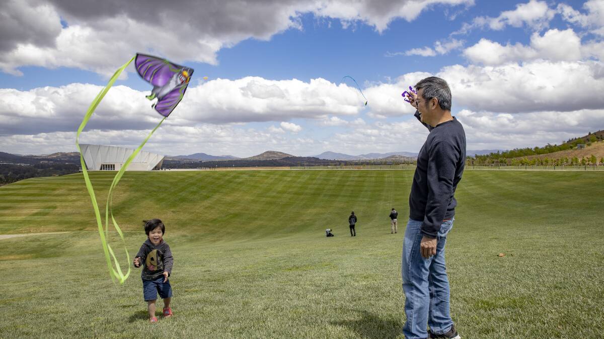 Aoi and Tanwa Pimdee from Dunlop take advantage of windy conditions at the National Arboretum on the weekend to indulge in a spot of kite flying. Picture: Sitthixay Ditthavong