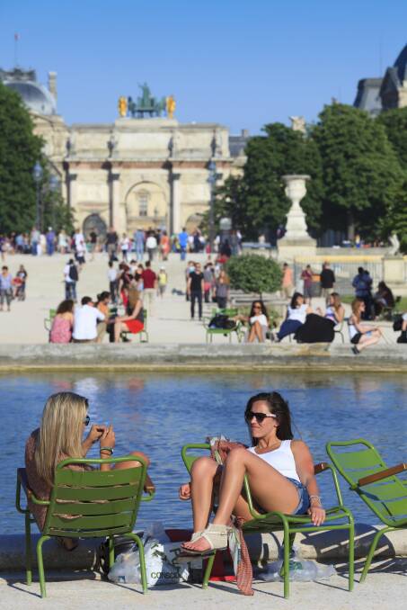 People relax at Jardin des Tuileries, a public garden located between the Louvre Museum and the Place de la Concorde in Paris. Picture: iStock