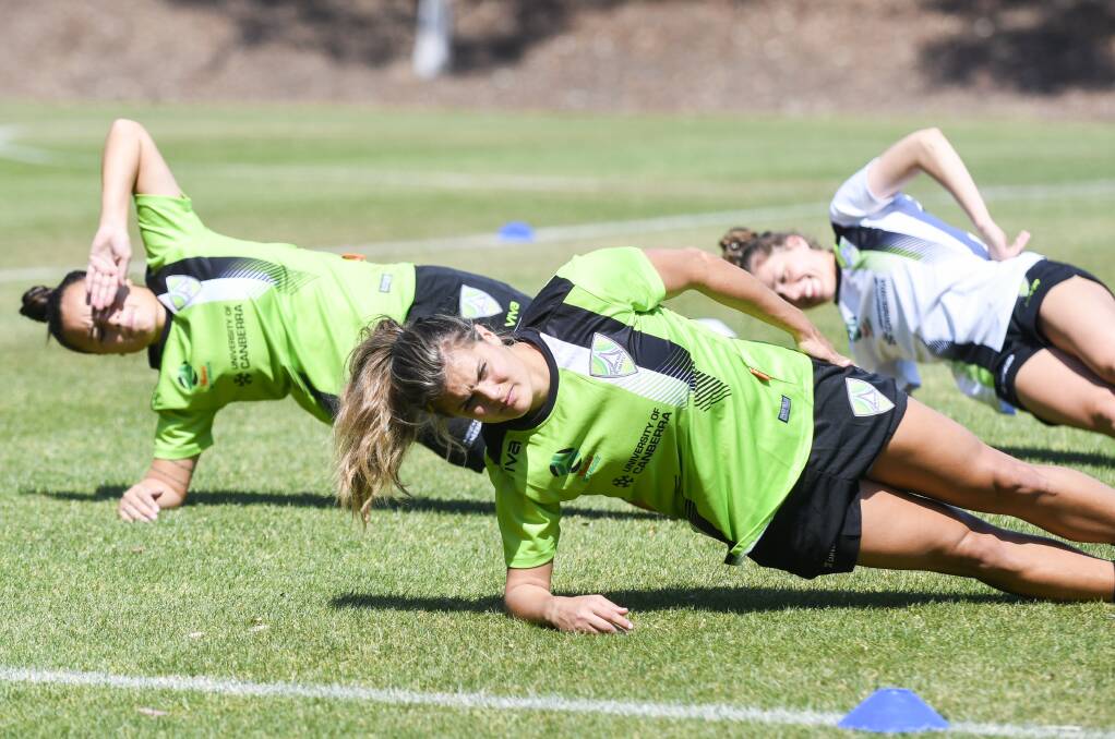 Katie Stengel (foreground) trains with Canberra United last Friday. Picture: Dion Georgopoulos