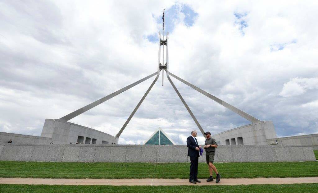 Prime Minister Scott Morrison compliments Parliament House turf manager Brock Weston on the glorious green lawns. Picture: Supplied