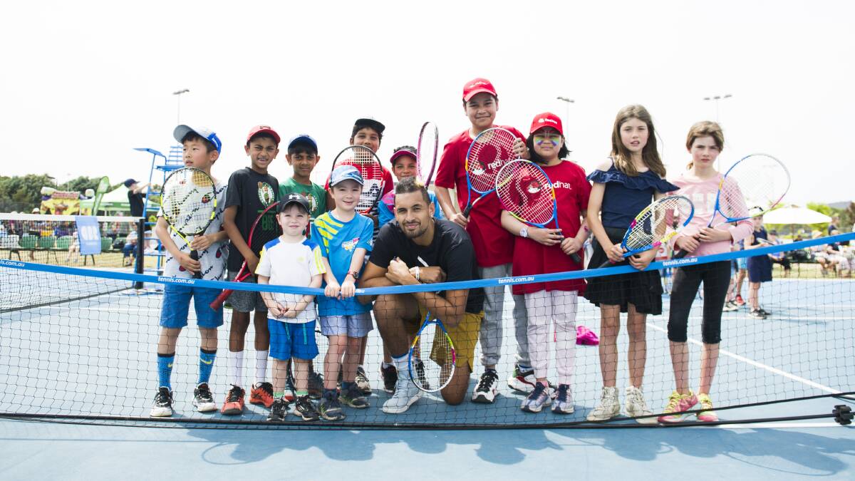Nick Kyrgios playing tennis with kids at a Community Tennis Day. Picture: Dion Georgopoulos