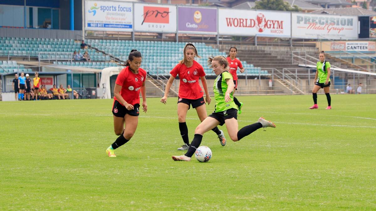Canberra United's Laura Hughes takes a shot at goal during a pre-season clash with Western Sydney. Picture: Sitthixay Ditthavong