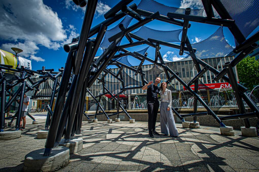 Max Maxwell and Erin Hinton under the temporary architecture pavilion in Civic Square. Picture: Karleen Minney
