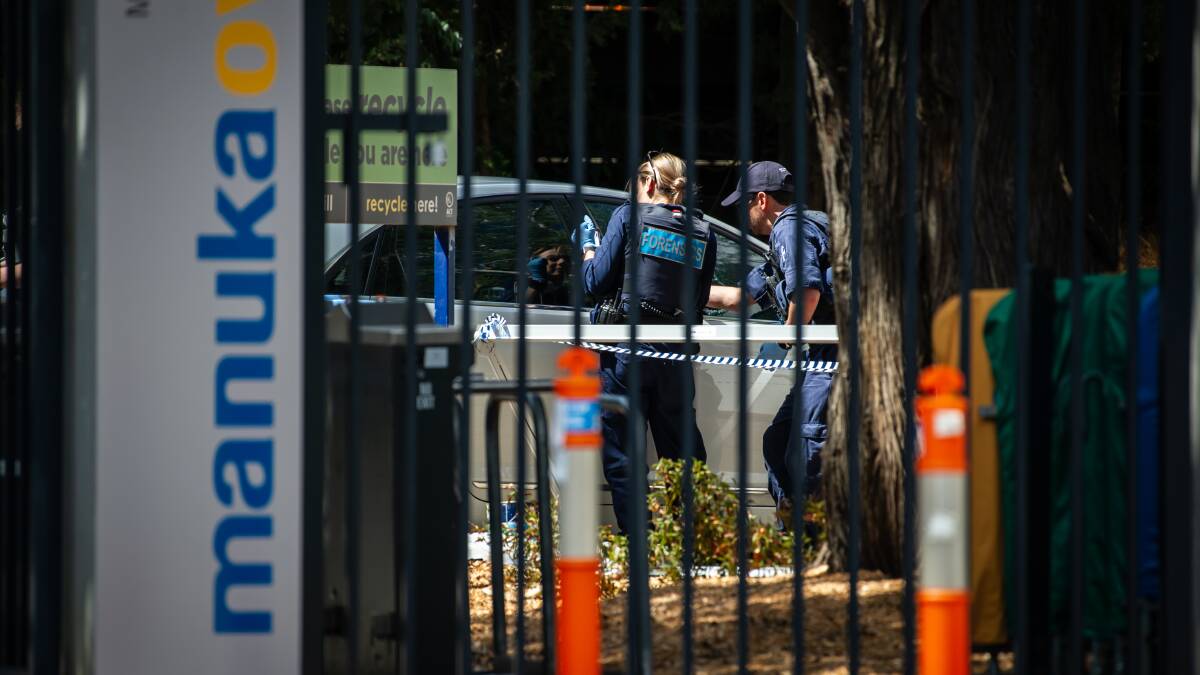 ACT policing crime scene investigators examine a car on the grounds of Manuka Oval. Picture: Karleen Minney