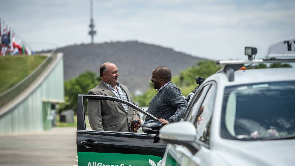 AllGreenCabs has been launched as a new taxi service in Canberra. Managing director Petar Johnson (left) with drivers manager and operator Shegun Odusote. Picture: Karleen Minney