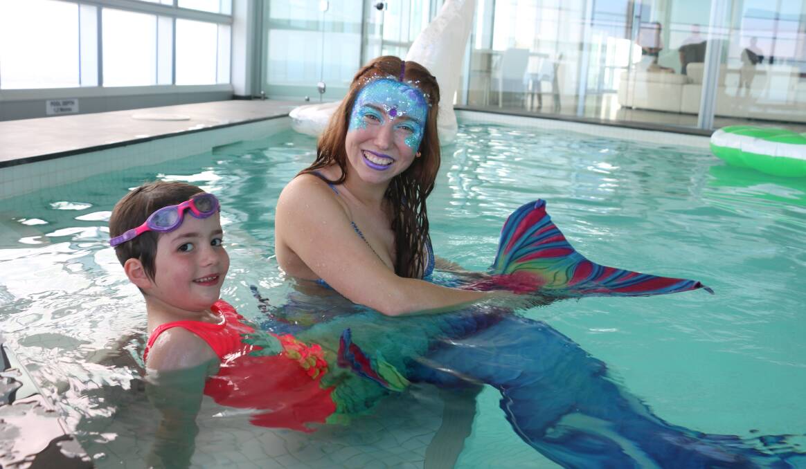 Canberra girl Paige Rule, 6, and her mermaid friend.