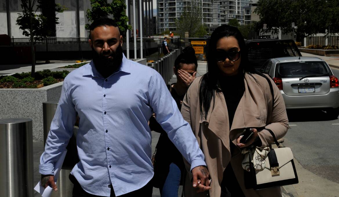 Benjamin James Moarefi outside the ACT Supreme Court last year with his partner, Anna Roufogalis. Picture: Blake Foden