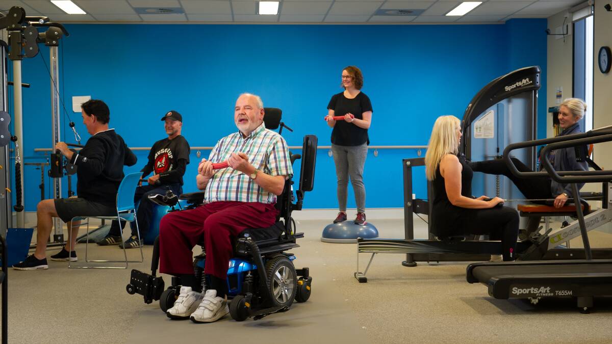 Julian Slater, Rob Oakley, John Ley, Carrie Coghlan, Michelle Anderson and Susan McLean all have muscular dystrophy, exercising at the University of Canberra health hub. Picture: Elesa Kurtz