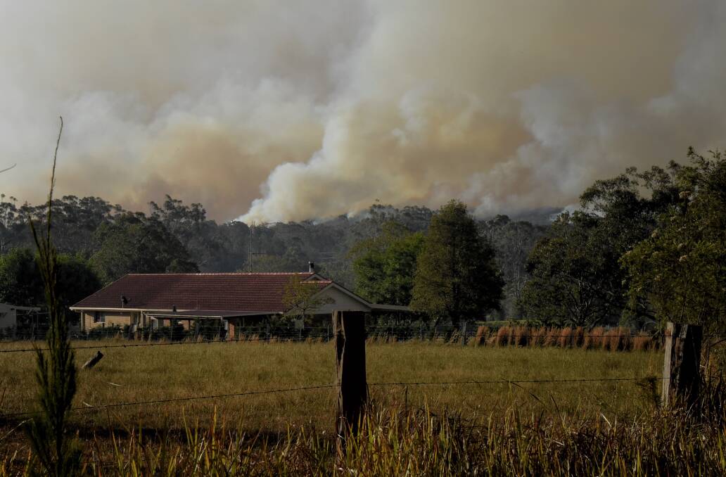 Smoke rises from the bushfires north of Forster Tuncurry in NSW. Picture: Kate Geraghty