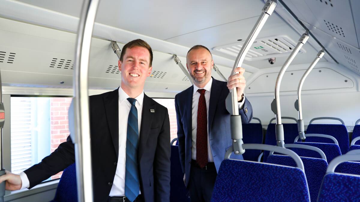 ACT transport minister Chris Steel and chief minister Andrew Barr inspecting the Yutong Electric E12 bus.
