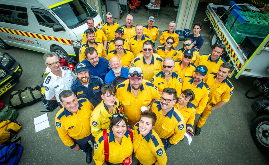 Queanbeyan firefighters all smiles as they prepare to fight the fires in northern NSW near Port Macquarie. Picture: Karleen Minney