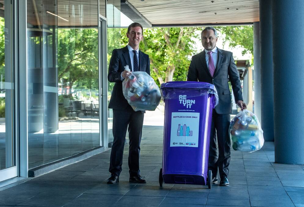 Minister for recycling and waste reduction Chris Steel and managing director of Re.Group David Singh launch an app where Canberrans can organise to have containers collected for the container deposit scheme. Picture: Karleen Minney