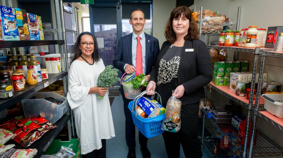Labor MPs Linda Burney and Andrew Leigh with Communities@Work director of social programs, Ruth Zanker at the community pantry in Gungahlin. Picture: Elesa Kurtz