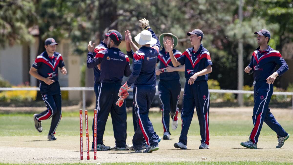 Eastlake players celebrate after Hayden Page bowled out Weston Creek Molonglo's Sam Taylor. Picture: Sitthixay Ditthavong