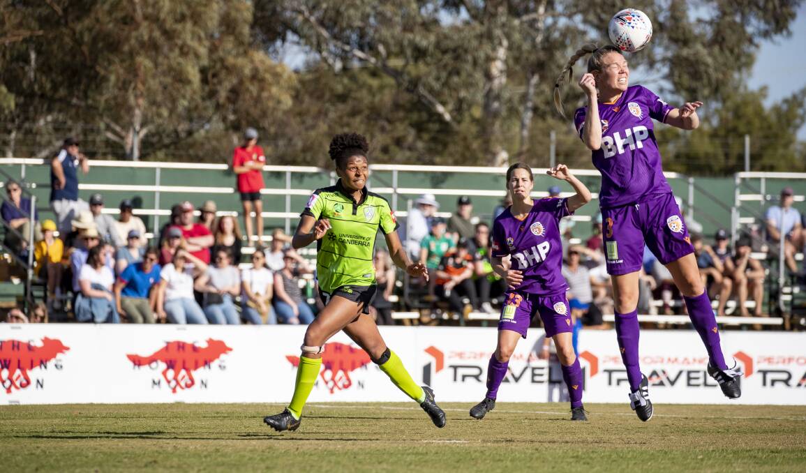 Canberra United's Simone Charley and Perth Glory's Kim Carroll. Picture: Sitthixay Ditthavong
