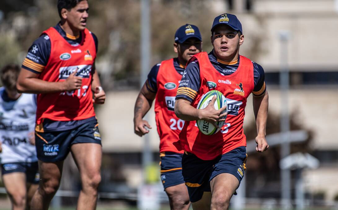 Noah Lolesio, right, led a new group of Brumbies into pre-season training. Picture: Karleen Minney