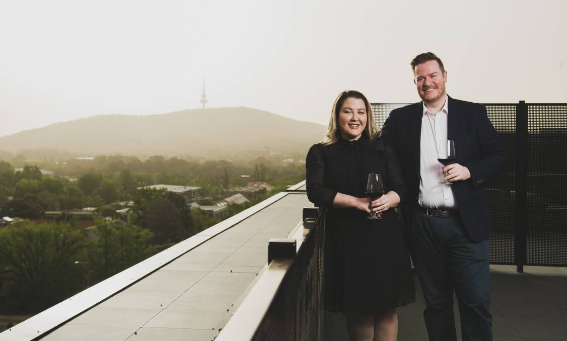 The first residents of Braddon's Midnight development Cassandra and Ben Smith at their penthouse apartment. Picture: Dion Georgopoulos