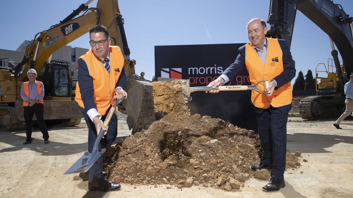 Senator Zed Seselja and Morris Property Group director Barry Morris at the sod turning of new apartment complex One City Hill. Picture: Sitthixay Ditthavong