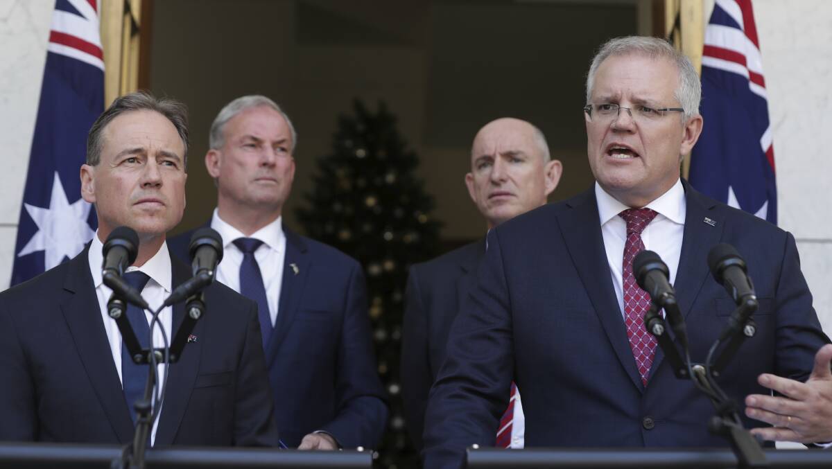 Minister for Health Greg Hunt, Minister for Aged Care and Senior Australians and Minister for Youth and Sport Richard Colbeck, Minister for the NDIS and Government Services Stuart Robert and Prime Minister Scott Morrison at Monday's announcement. Picture: Alex Ellinghausen