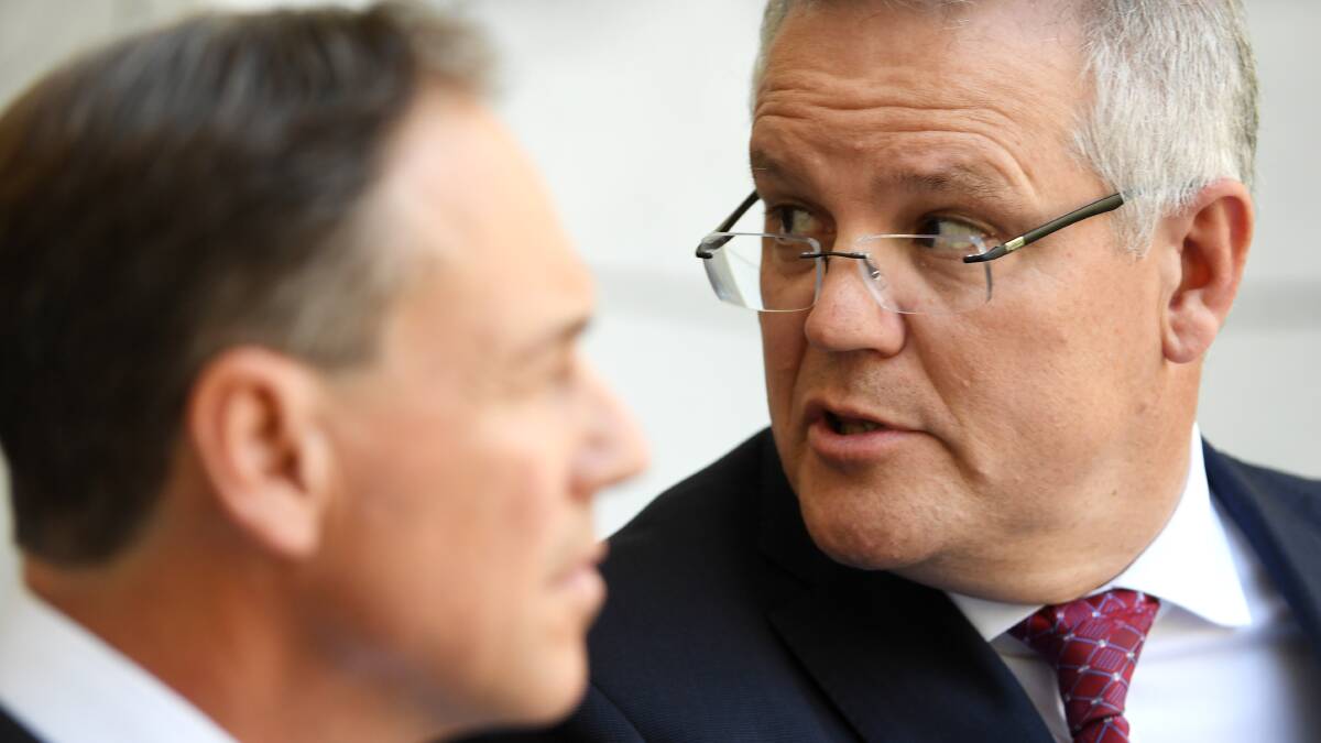 Prime Minister Scott Morrison, right, with Minister for Health Greg Hunt. Picture: Getty Images