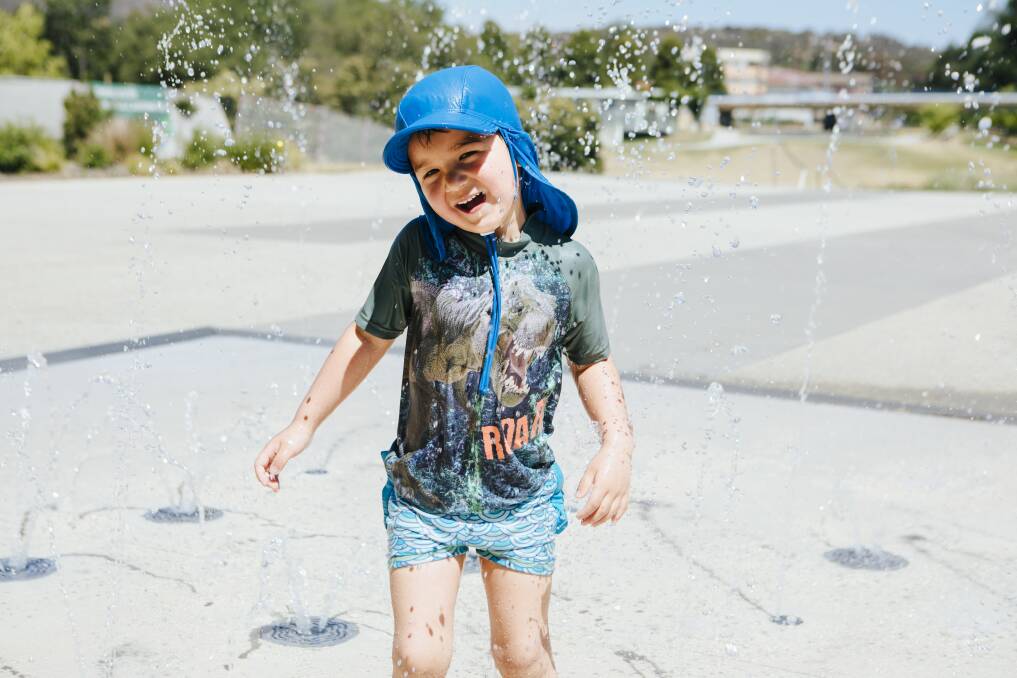 Yamato Buckley, 5, of Tarago, cools down on Thursday at a water feature in Queanbeyan. Picture: Jamila Toderas