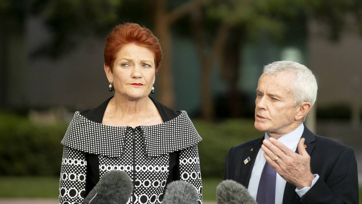 One Nation senators Pauline Hanson and Malcolm Roberts speak to media after they voted against the government's union-busting bill on Thursday. Picture: Sitthixay Ditthavong