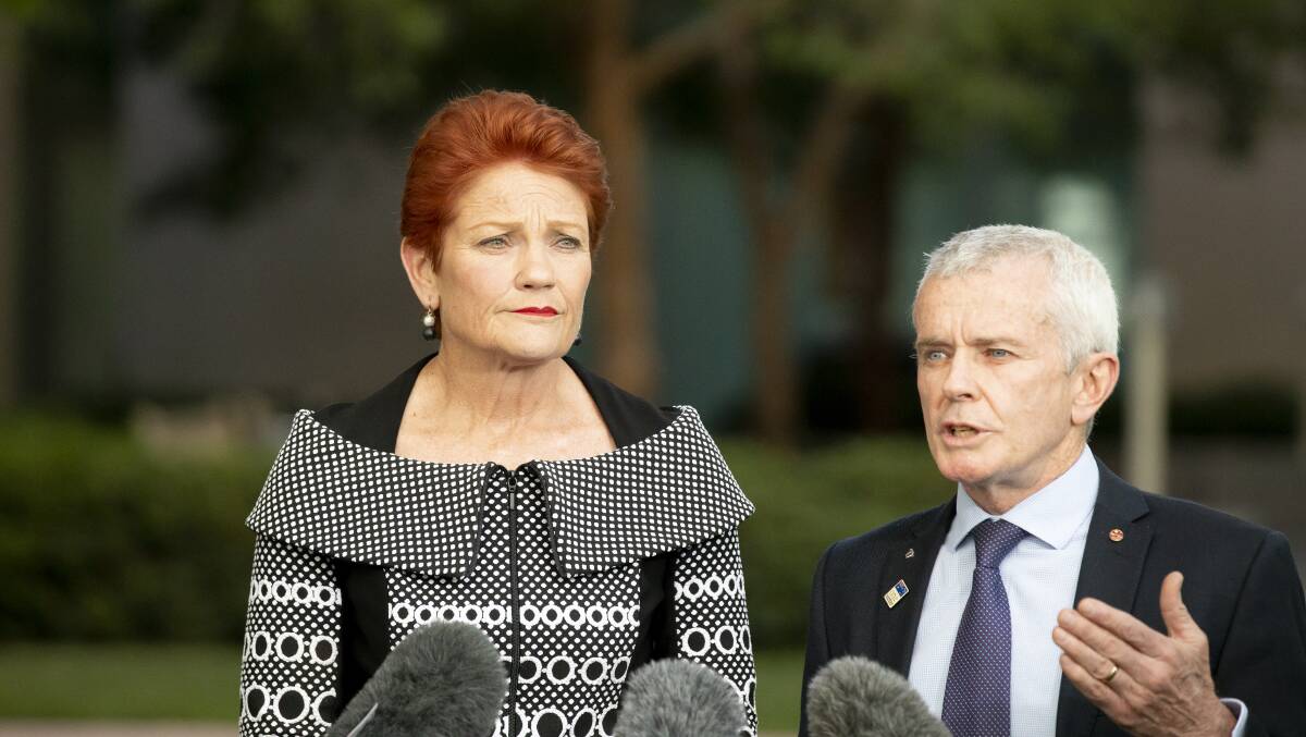 One Nation senators Pauline Hanson and Malcolm Roberts: Children are being indoctrinated on history, science and sex. Picture: Sitthixay Ditthavong