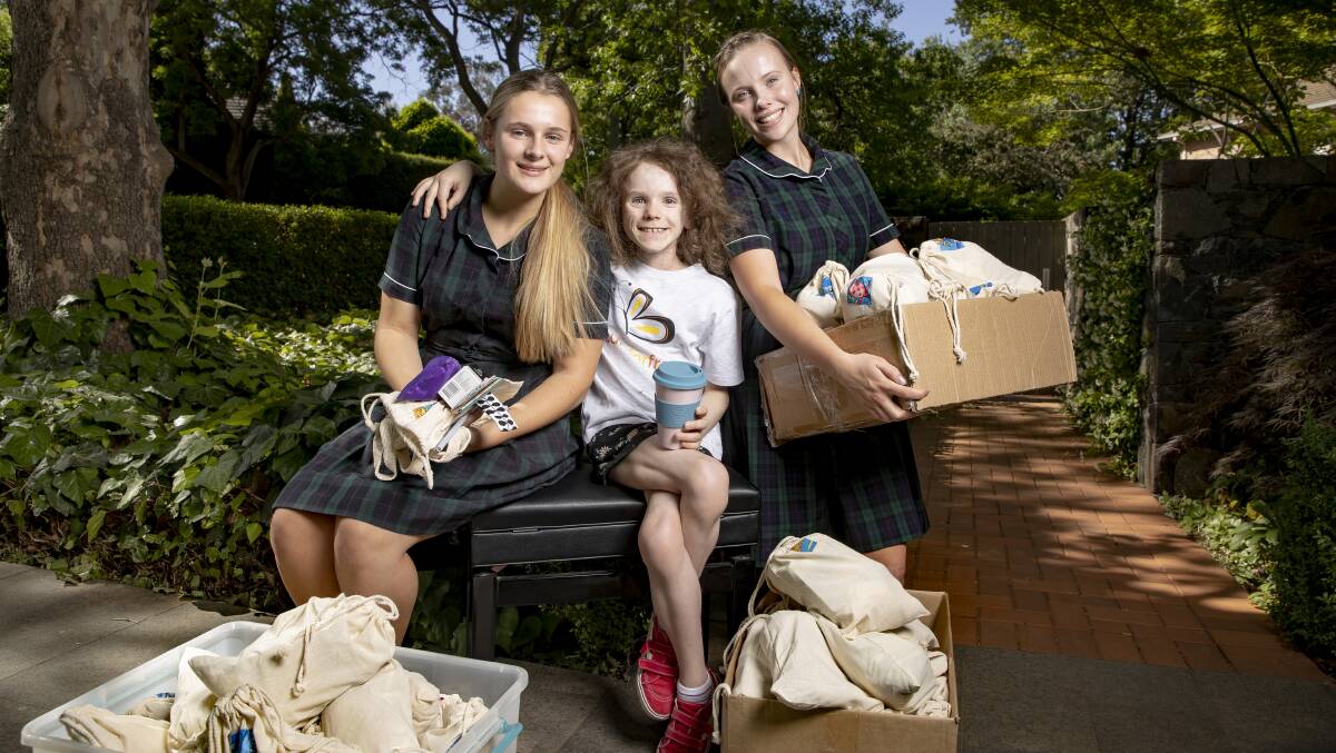 Nicola Duncan and Eliza Coggan have set up Plastic Free for Freyja selling sustainable alternatives to raise money for their friend Freyja Christiansen (centre) who has been diagnosed with a rare form of cancer. Picture: Sitthixay Ditthavong