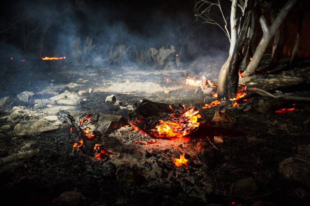 Smouldering remains from aftermath of the NSW Tallaganda bushfire in Bombay. Picture: Dion Georgopoulos