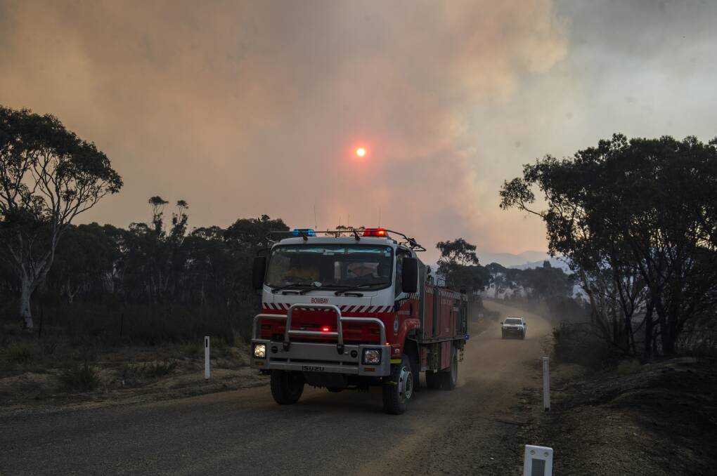 Fire trucks patrolled Bombay, NSW on Saturday evening for spot fires caused by the North Black Range bushfire. Picture: Dion Georgopoulos