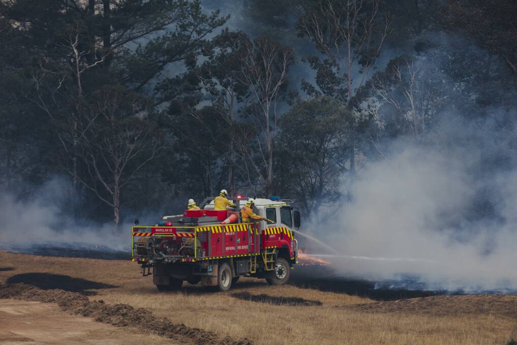 Fire crews on the ground at the fire near Braidwood on Sunday. Picture: Jamila Toderas
