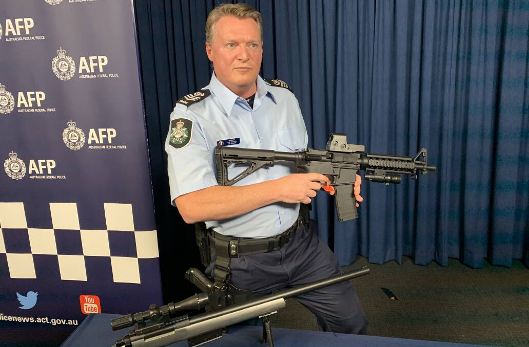 ACT police detective sergeant Rod Swain, with illegal gel blasters. Picture: Andrew Brown