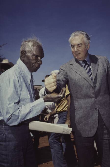 Mervyn Bishop's photograph of prime minister Gough Whitlam pouring soil into the hand of traditional landowner Vincent Lingiari in 1975. Picture: Courtesy Josef Lebovic Gallery, Sydney