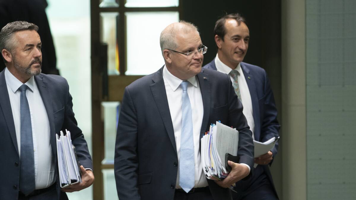 Prime Minister Scott Morrison, centre, hasn't impressed his colleagues with his response to the bushfire crisis. Picture: Sitthixay Ditthavong