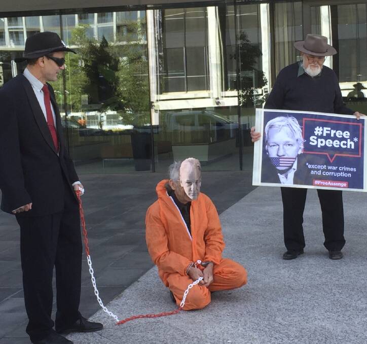 'Eli' Jessup dressed as Julian Assange, along with supporters. Picture: Supplied