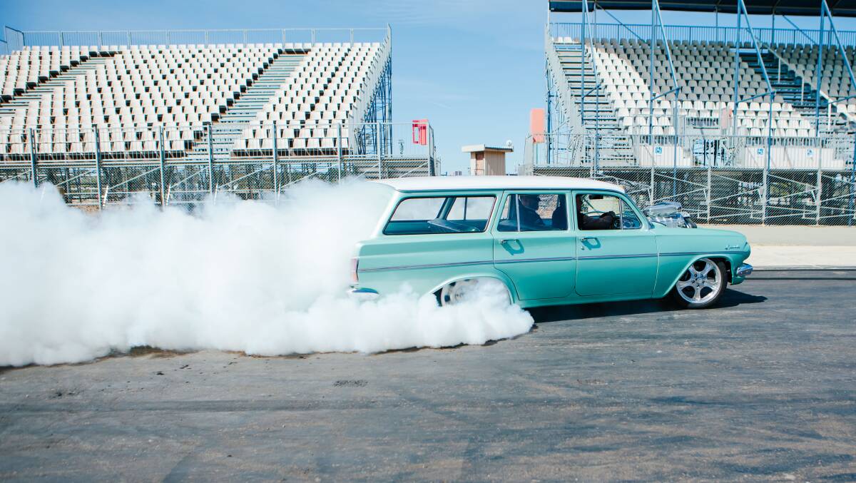 Chief Minister Andrew Barr enjoys a joyride in a car doing some burnouts on Wednesday. Picture: Jamila Toderas