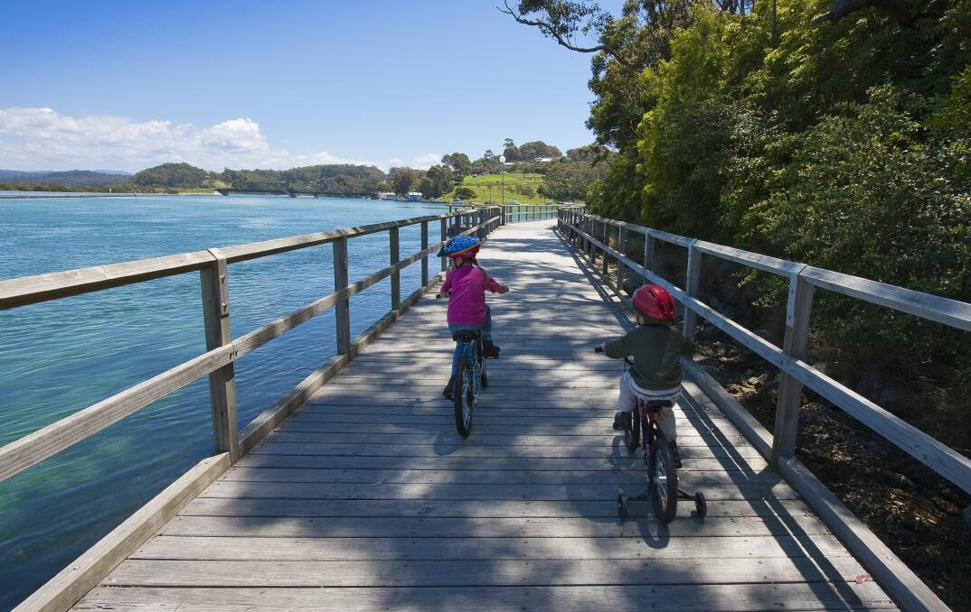 Riding along the Narooma boardwalk. Picture: Supplied