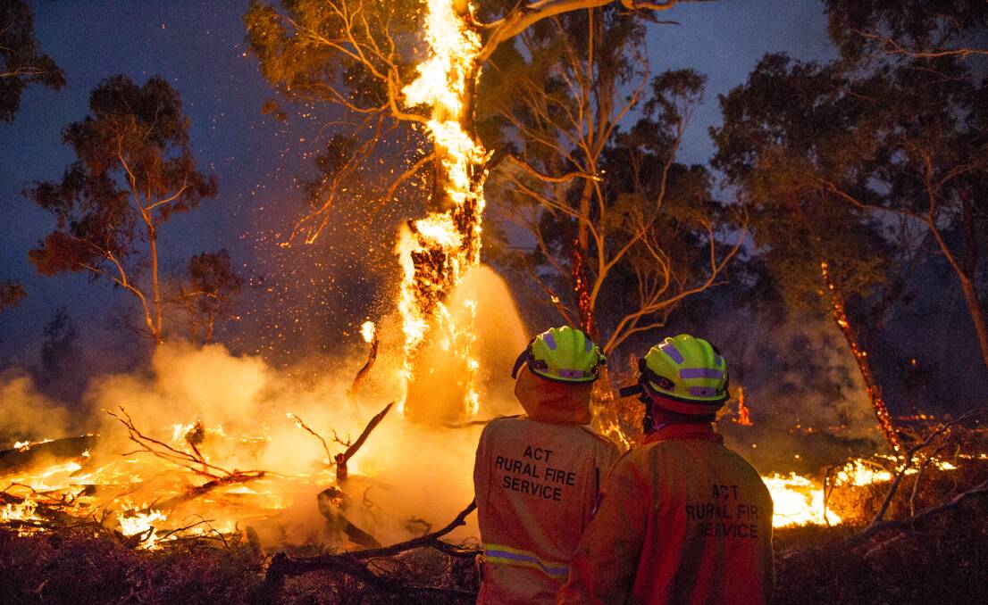 Firefighters work to put out fires at Warri near the edge of the North Black Range bushfire. Picture: Dion Georgopoulos