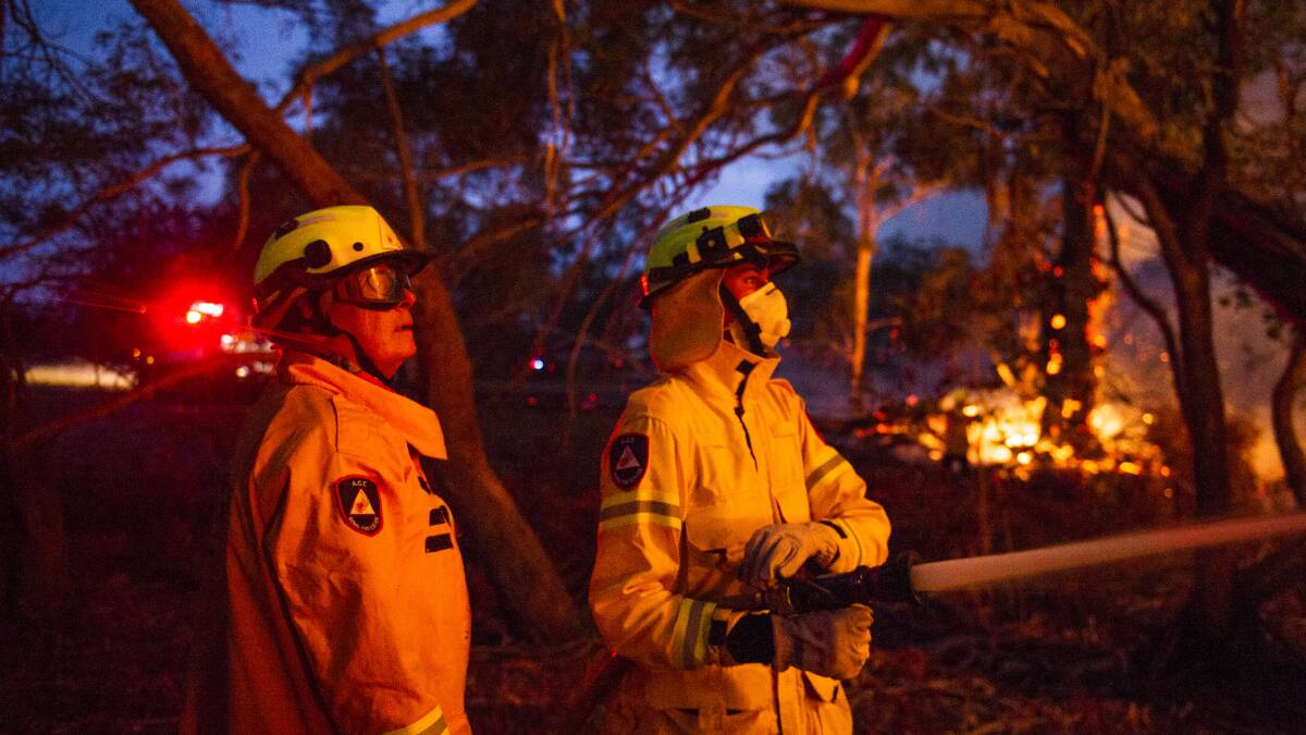 Firefighters work at the edge of the North Black Range bushfire. Picture: Dion Georgopoulos