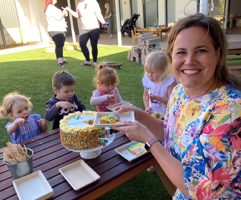 Wonderschool's Sarah Wilcox celebrates with children at the Throsby centre this week.